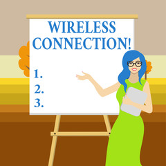 Text sign showing Wireless Connection. Business photo text there is no physical wired connection between networks White Female in Glasses Standing by Blank Whiteboard on Stand Presentation