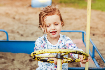 the child plays on the Playground