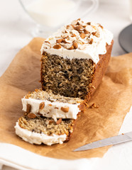 Brown cake with white cream and  nuts
