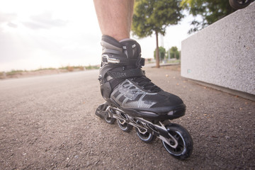 man with inline skates skating on the street
