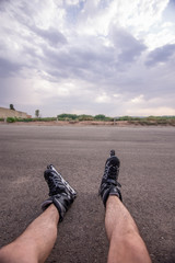 man with inline skates skating on the street