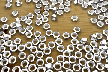 screw-nuts on wooden table - creative industrial 3D illustration, picture for art using