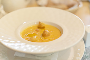 cream soup in a deep white plate