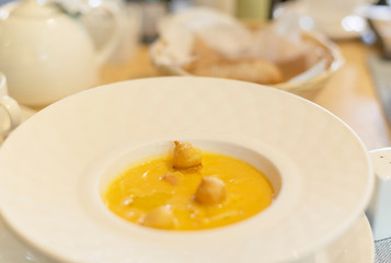 cream soup in a deep white plate