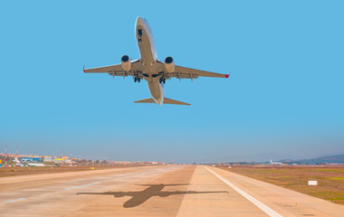 Passenger airplane takes off from the airport runway