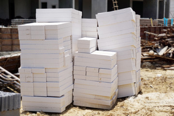 Light concrete blocks placed on the ground as building materials and industrial backgrounds. reduce heat, endure lightweight, strong, easy construction, copy space.