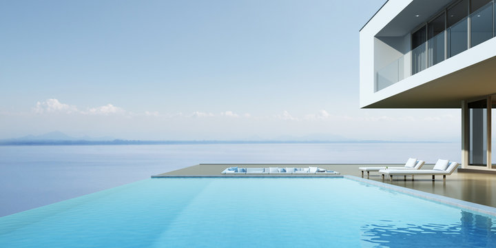 Perspective of luxury modern house with overflow swimming pool and sofa on sea view background, Idea of minimal architecture design. 3D rendering	