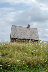 Abandoned home sinking into the marsh on Prince Edward Island in Canada