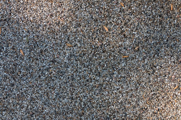 Background, texture of a garden path from a small natural stone.