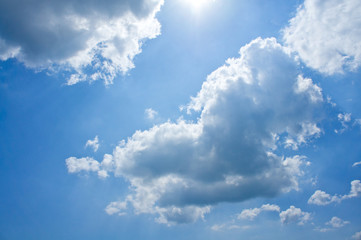 Beautiful blue sky with white clouds above the sea on a sunny summer day