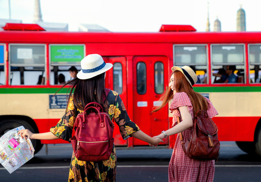 Two asian girlfriends traveling and transportation by bus