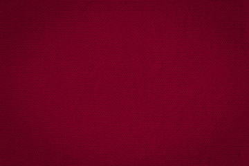 Texture of real  dark burgundy knitwear, textile background. Dark red knitted background