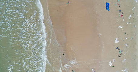 Trash, plastic, garbage, bottle... environmental pollution on the beach. Royalty high-quality free stock photo image of trash, plastic bottle on the beach. Waste that polluted the ocean environment