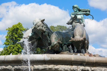 Fototapeta premium COPENHAGEN, DENMARK - JUNE 22, 2019 : Gefion Fountain located in port in Nordre Toldbod area next to Kastellet
