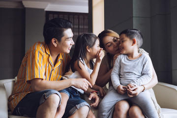 Happy family with kids spending time together at home.