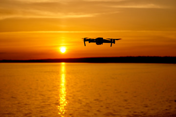 Fototapeta na wymiar Drone flying at the sunset moment