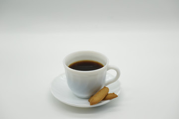 Cup of coffee with biscuits on white background