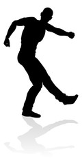 A male street dance hip hop dancer in silhouette