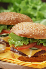 Two fresh hamburgers with vegetables