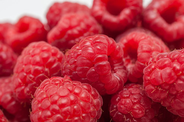 Delicious fresh ripe raspberries on white background