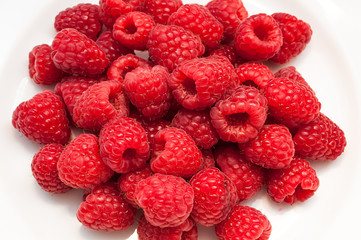 Delicious fresh ripe raspberries on white background