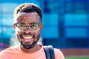 face recognition concept. black afro man in the street with a smile