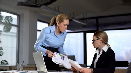 Boss scolding colleague for unfinished report before deadline, failed contract