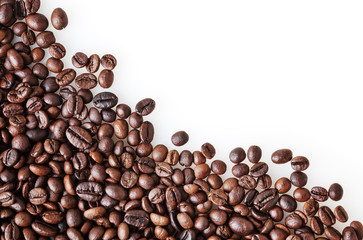 Roasted coffee beans on white background with copy space
