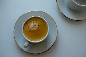 A Cup of morning invigorating coffee for a better mood in the morning.