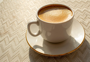 A Cup of morning invigorating coffee for a better mood in the morning.