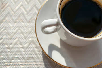 A Cup of morning invigorating coffee for a better mood in the morning.