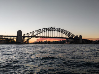 Naklejka premium Silhouetted view of Sydney Harbour Bridge at sunset, Australia