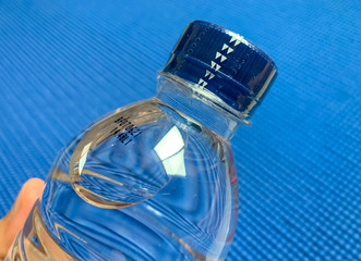 Cap seal on bottle of blue background