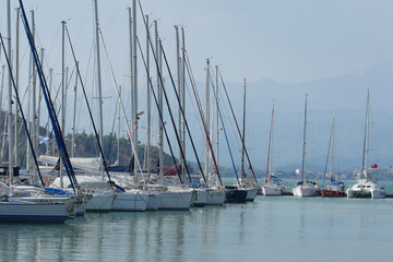 Fototapeta na wymiar Many yachts at the pier in the marina Fethiye, Mugla, Turkey.