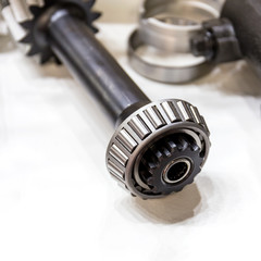 Metal part for industrial equipment.Block bearing and gear