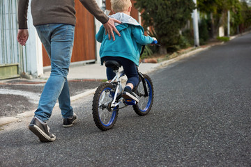 Father son riding bikes