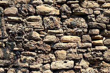 The old masonry of roughly processed stones