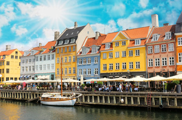 Fototapeta na wymiar Panorama of north side of Nyhavn with colorful facades of old houses and old ships in the Old Town of Copenhagen