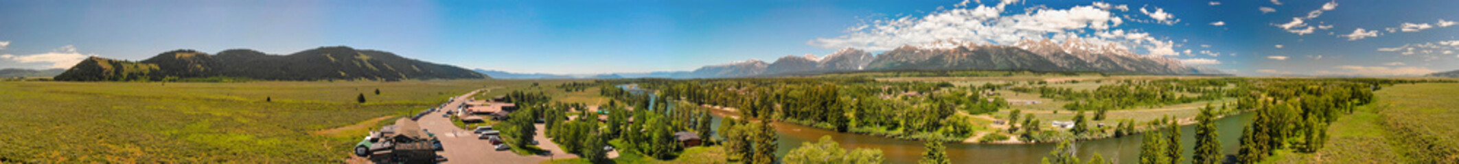 Fototapeta na wymiar Panoramic aerial view of Grand Teton peaks, landscape and Snake River on a beautiful summer day, Wyoming - USA