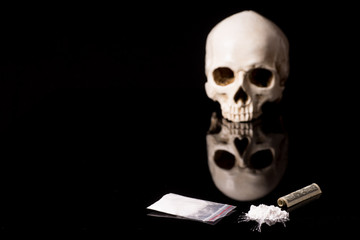 cocaine or other illegal drugs lying on a glossy background