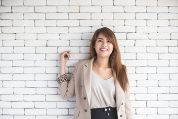 Half length image of Asian businesswoman laughing.