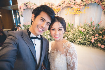 Bride and groom selfie photo at wedding ceremony..