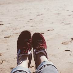 Naklejka premium Girl relaxing on sand beach