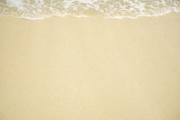 Tropical beach with white coral sand and calm wave with space for text background                   
