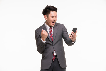 Businessman using  smartphone, excited by it..