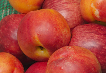 fresh peaches and apples on the market