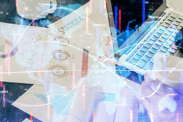 Obraz premium Double exposure of businessman working on laptop on background. International business hologram in front. Concept of success.