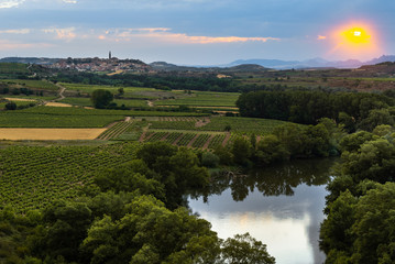 Ebro river at sunset with Briones village as background, La Rioja, Spain