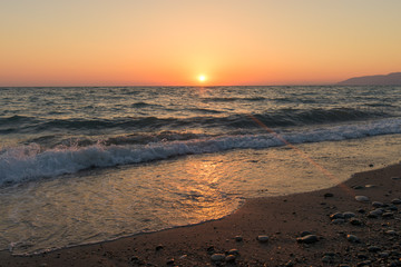 Fototapeta na wymiar sunset on the sea in Abkhazia