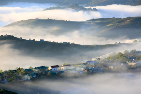 dramatic beauty landscape with magic fog and light cover small village in valley at the sunrise, photo used for advertising travel, magazine, printing and more © Khanh